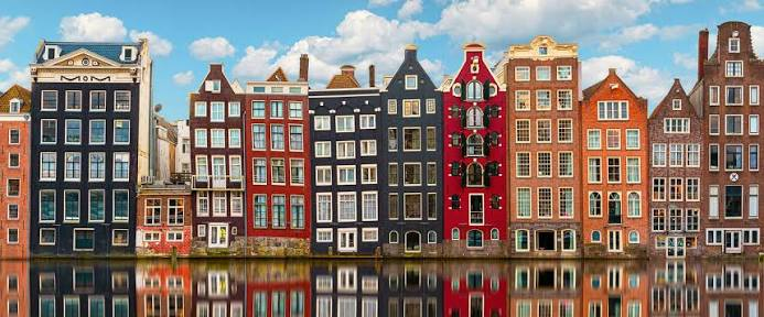Canal-side buildings in Amsterdam representing a European real-estate portfolio
