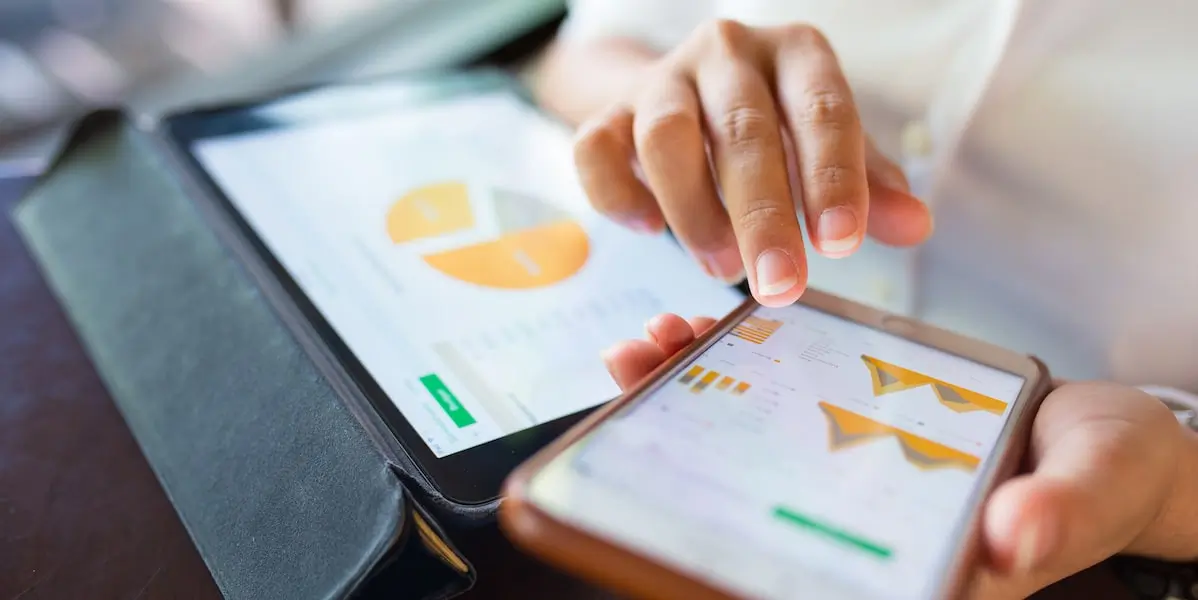 Financial analytics displayed on a tablet and phone
